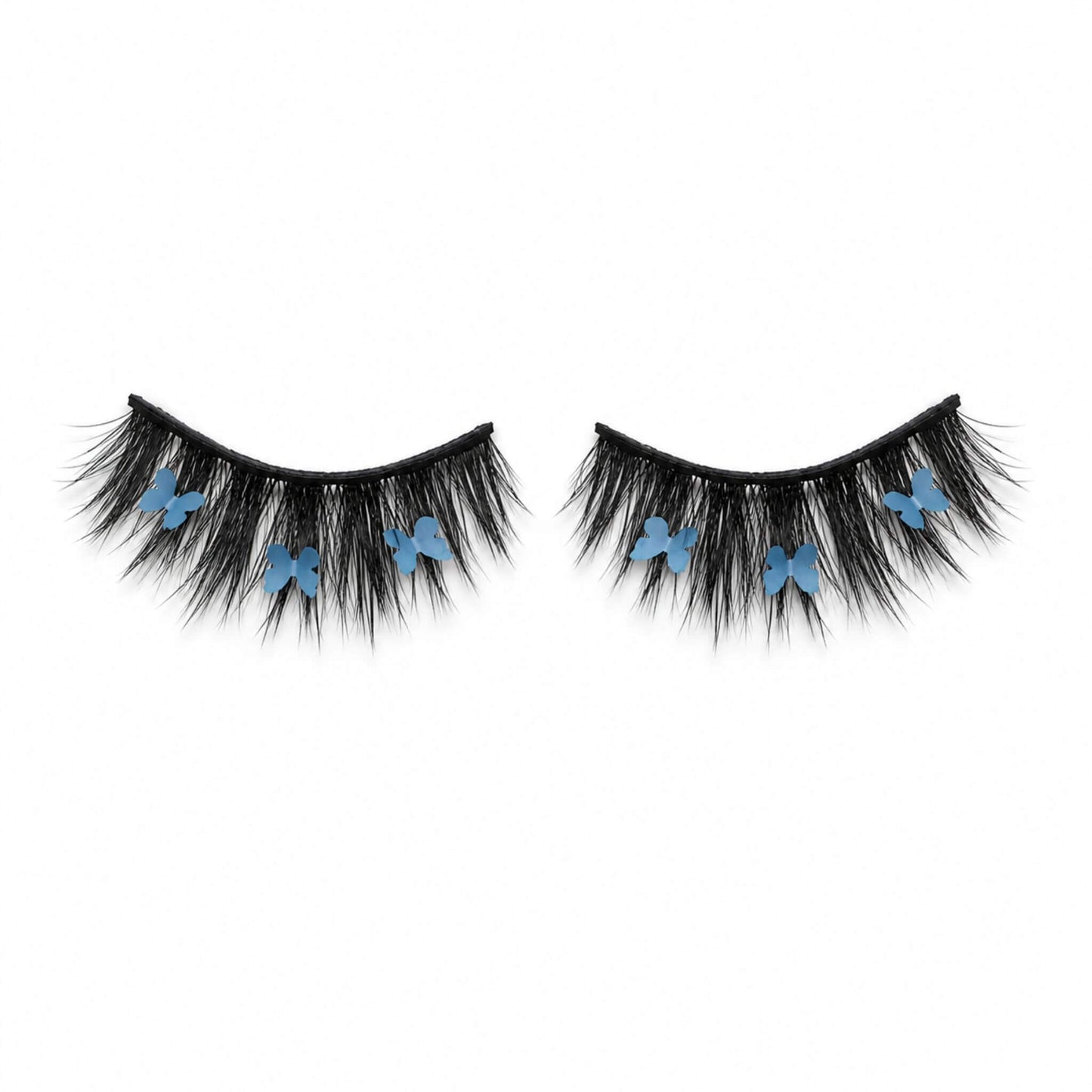 CHRYSALIS blue butterfly lash on white background, showing wispy black lashes and blue butterfly details.