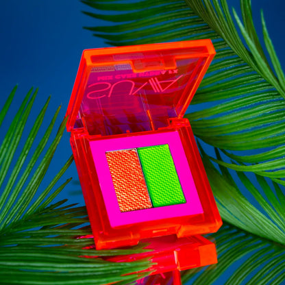 Lime green and orange eyeliner with blacklight glow