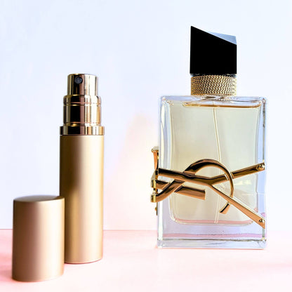Libre EDP travel spray decant in gold